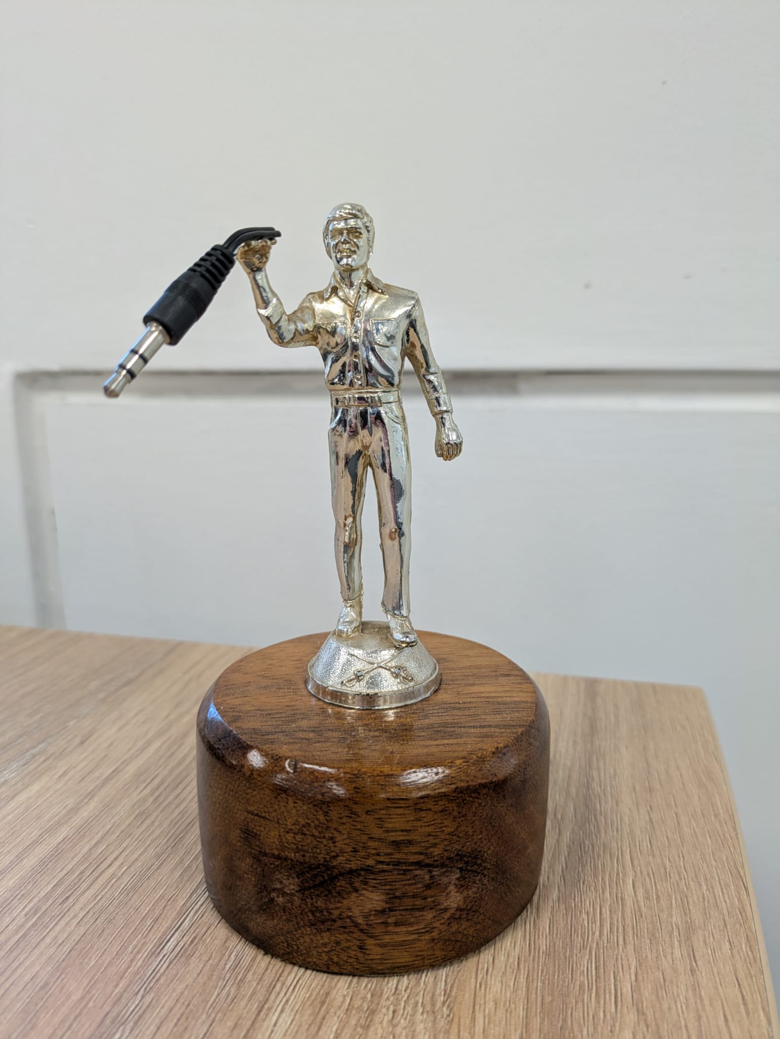 Music league pass the aux cable trophy