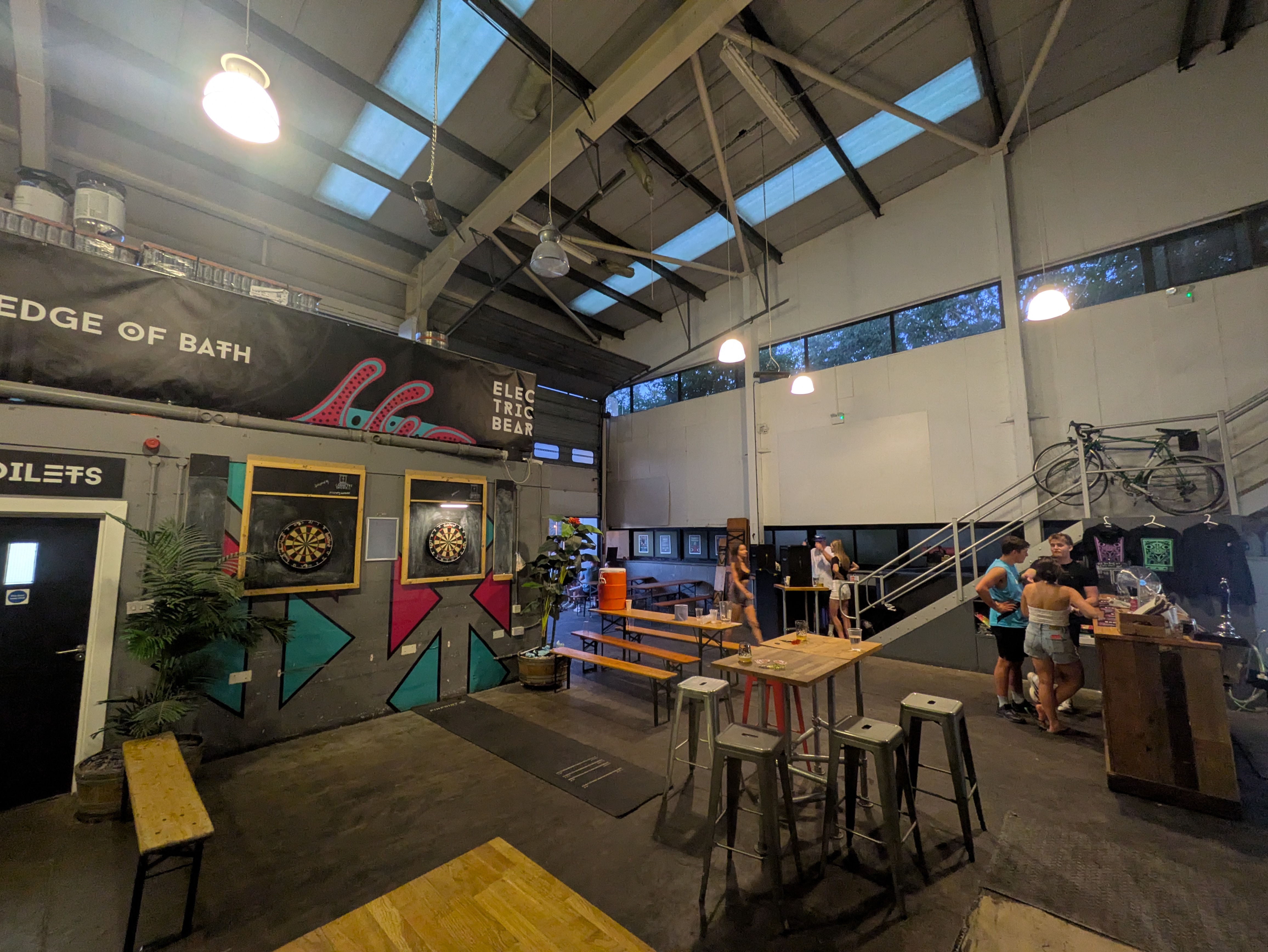 a wide shot of the brewery, showing the bar and some benches