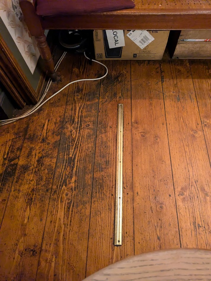 a picture of the oche, a narrow metal bar screwed to the floor
