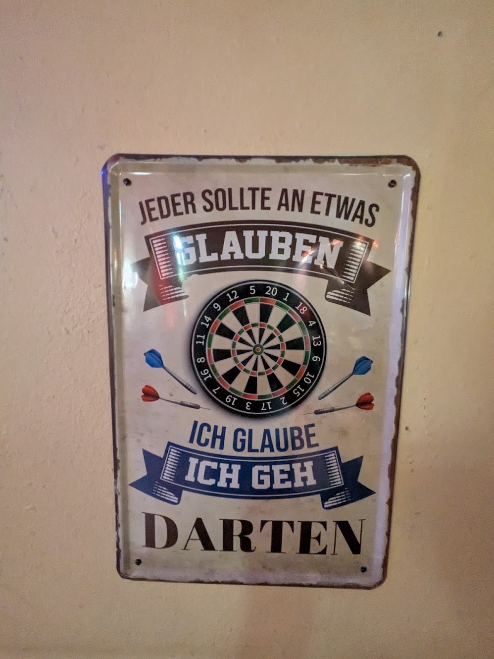 One of many metal signs in the pub, this one in german, translation in caption