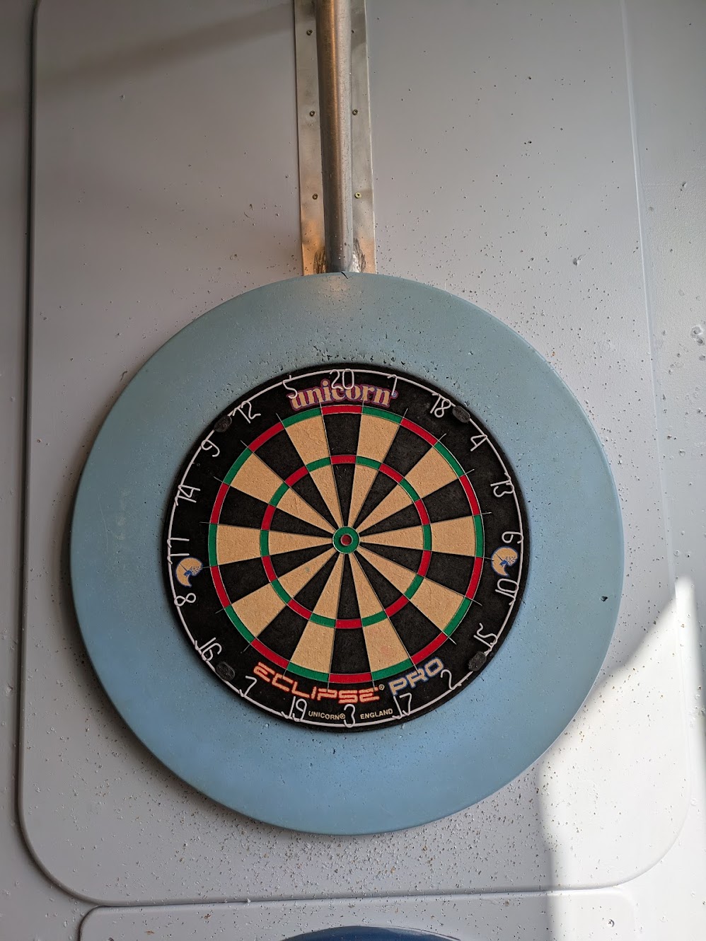 A close up picture of the dartboard