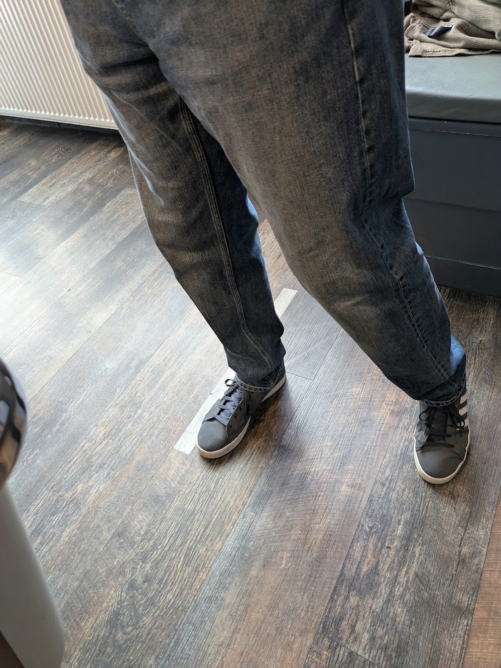 The oche, a half metre strip of tape, with tim's foot up against it as he throws