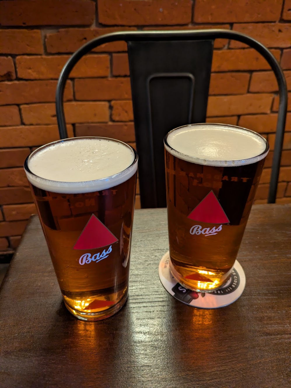 Two full pints of bass on the table