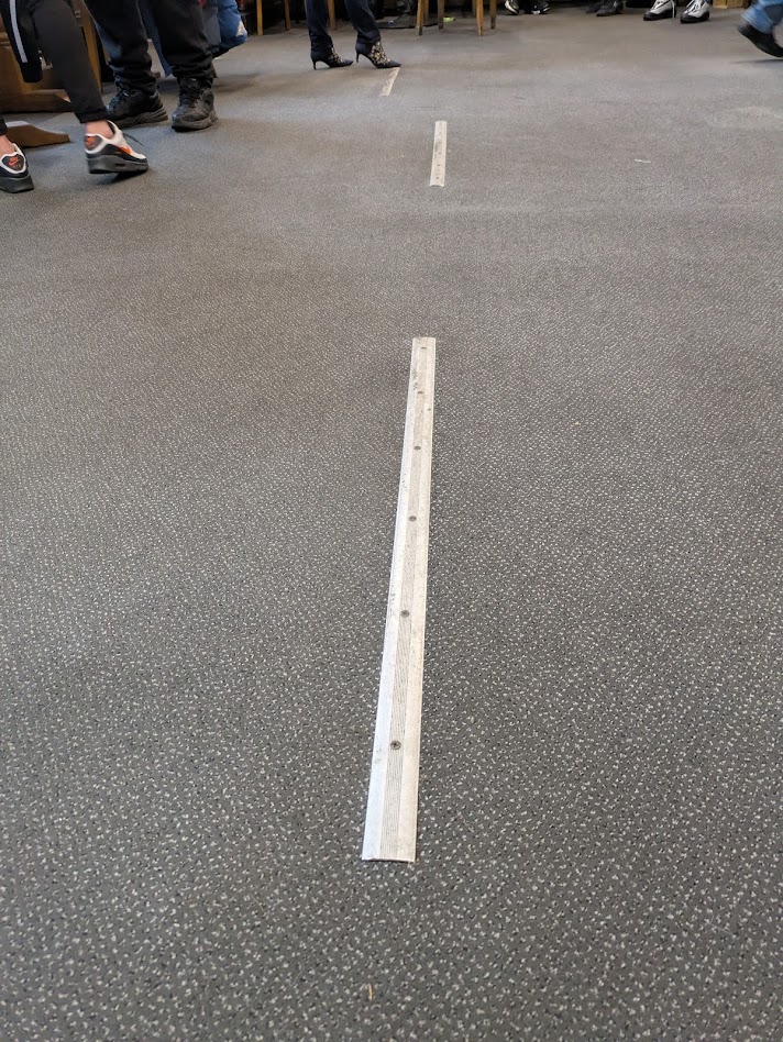 a metal strip on the floor, about a metre wide