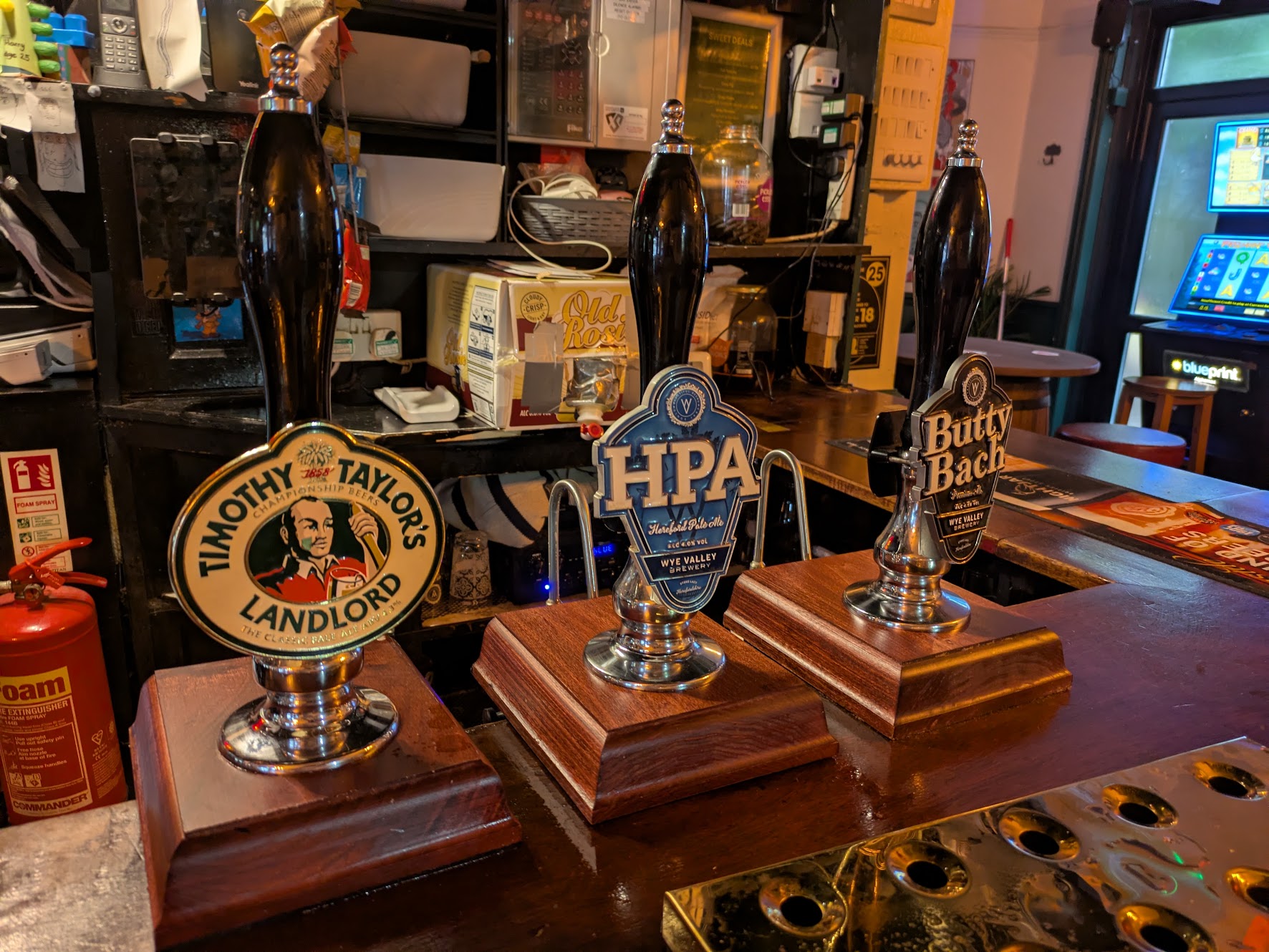 A picture of three beer clips, Landlord, HPA and Butty Bach