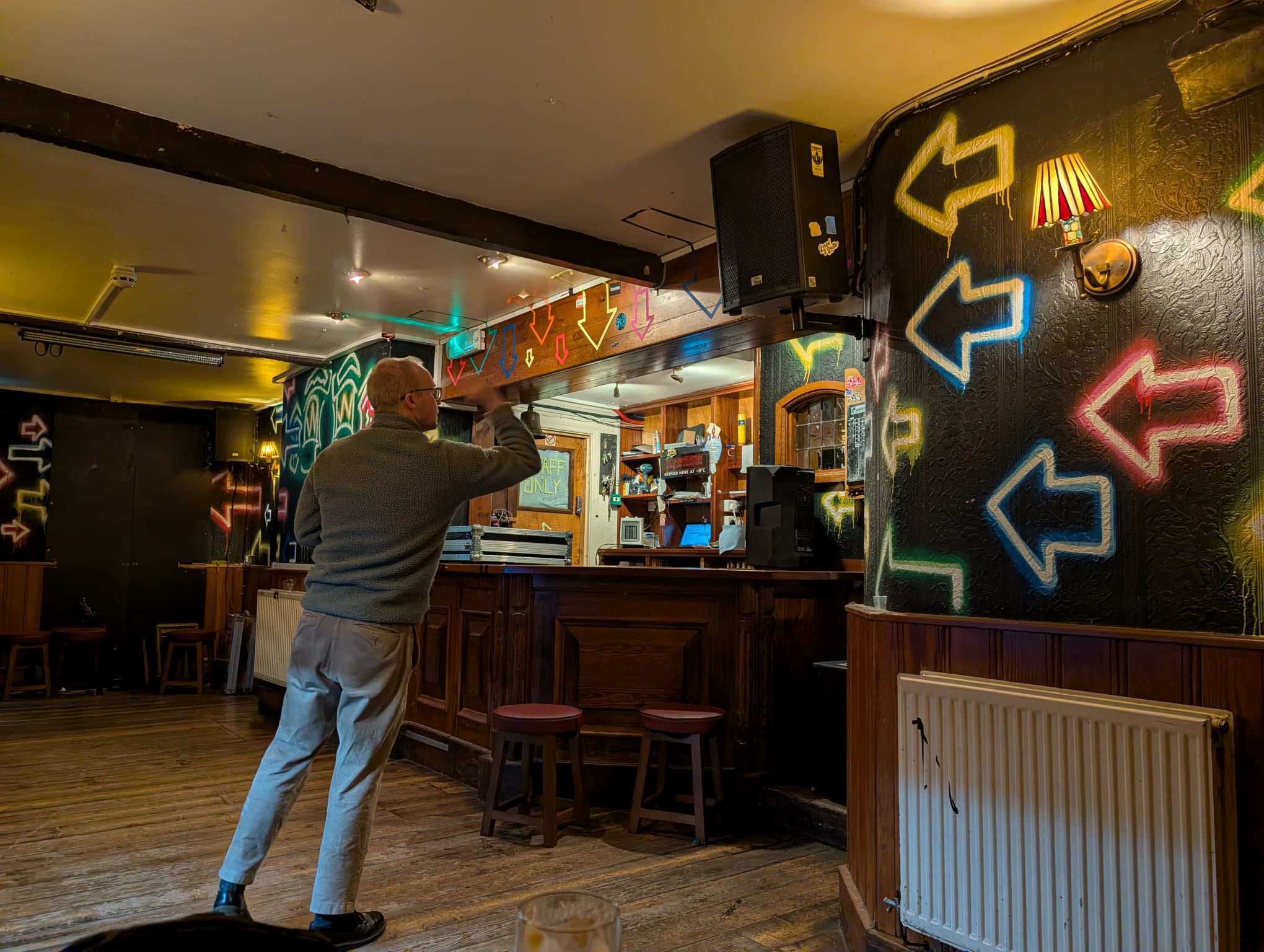 Action shot of me throwing an arrow at the dartboard