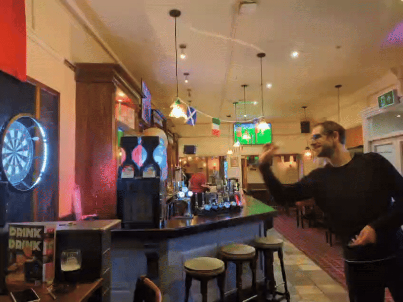 A gif of Tim throwing arrows